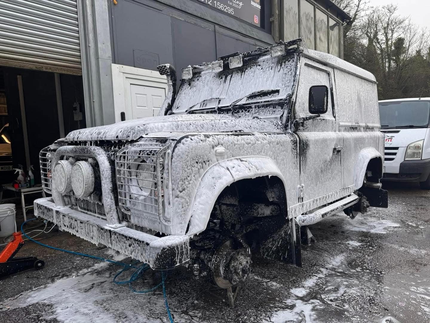 Land Rover Defender being foam-washed in the Brite Wight studio